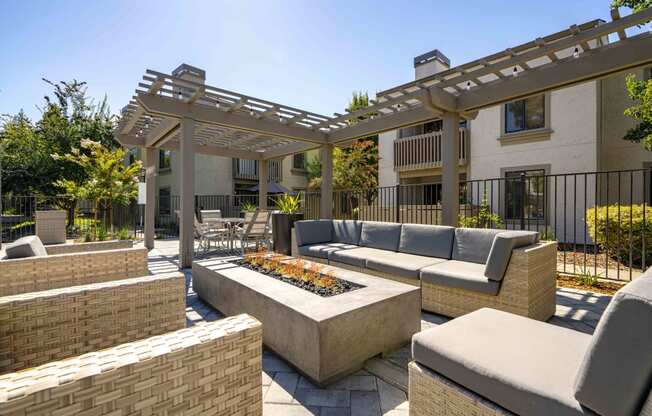 Apartments for Rent Walnut Creek - Park Lake at Walnut Creek - Relaxing Fire Pit with Cozy Seating, Tables and Chairs, and Highly Designed Pergola