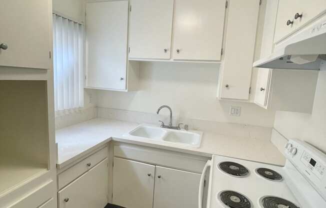 Kitchen with White Appliances and White Cabinets