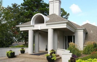 a white building with a sign in front of it