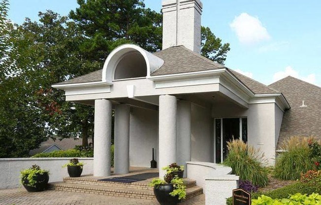 a white building with a sign in front of it