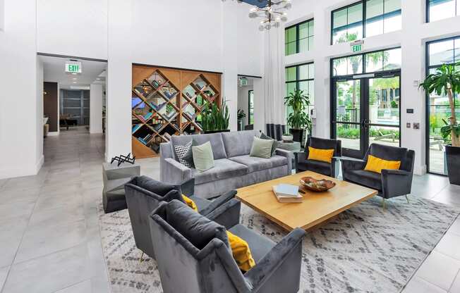 a living room filled with furniture and a large window