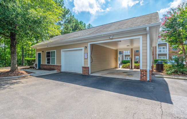 a carport with a garage door open
