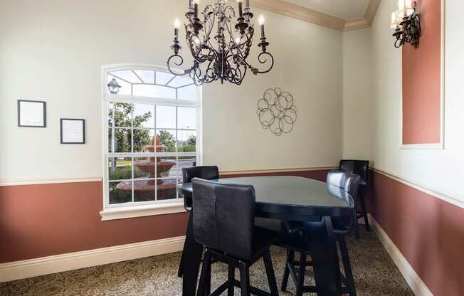 Rapallo Apartments community conference room. The conference room will have one bar- style triangular table with 3 barstool seats.