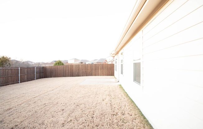 Located in the Trails at Riverstone community, this inviting 5-bedroom, 2-bathroom home offers a comfortable layout