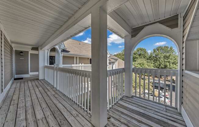 the view from the deck of a house with a white railing