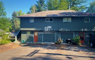 Spacious Multnomah Village Duplex sits amongst a treetop setting. Fenced Backyard. Landscaping Included!