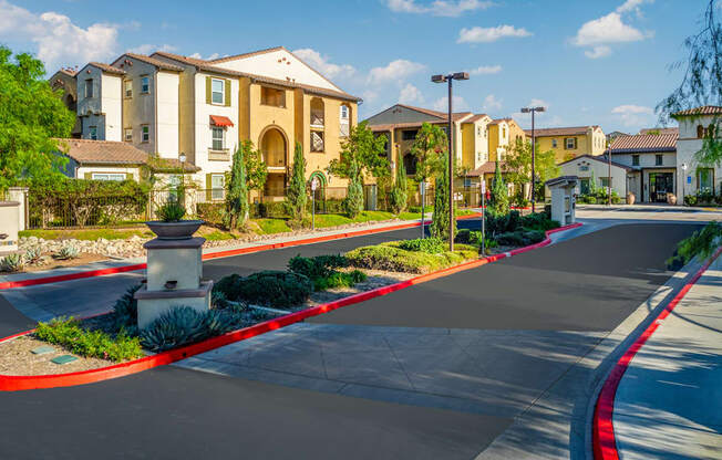 an empty street in front of an apartment building