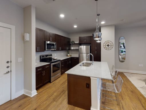 a kitchen with a marble counter top and