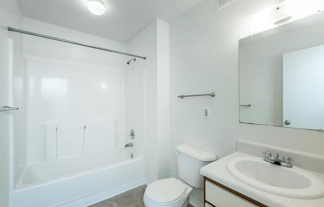a room with a sink and a mirror