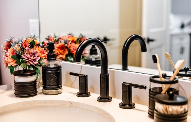 a bathroom sink with a black faucet