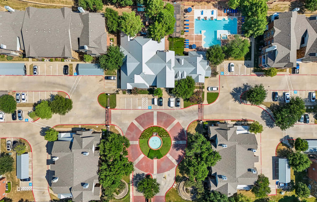 an aerial view of a neighborhood with houses and trees