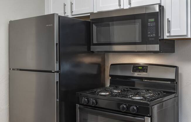 Stainless Steel appliance package with range, fridge and mounted microwave at Terraces at Clearwater Beach, Florida