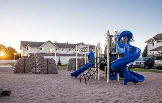 On-site playground with slides and climbing area at pet-friendly Aurora CO apartments.