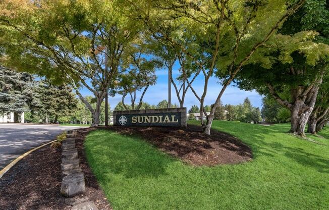 a sign for the apartments at Sundial Apartments, Wilsonvile