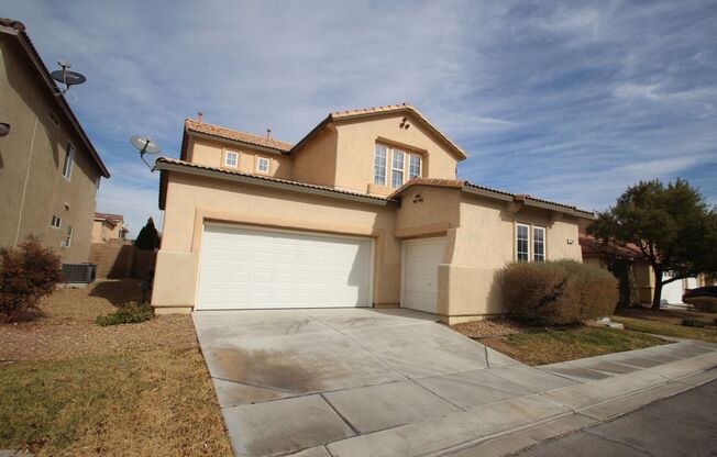 Beautiful 2-story home with 4 bedrooms located in Nevada Trails with downstairs bedroom
