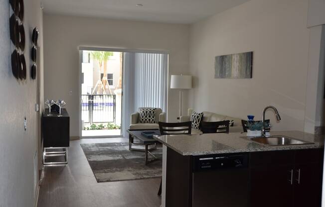 a view of the living room and dining room from the kitchen