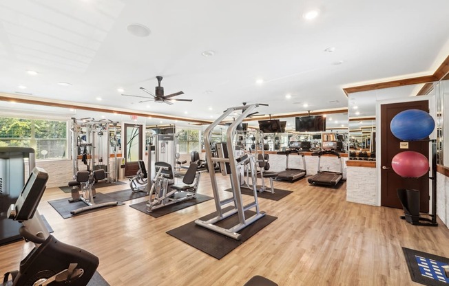 Fitness Center with cardio and strength training machines at Capital Grand Apartments in Tallahassee, FL