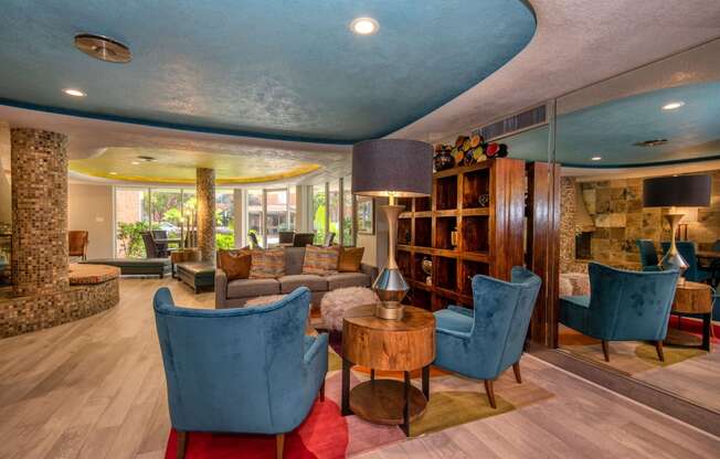 a living room filled with furniture and a large window