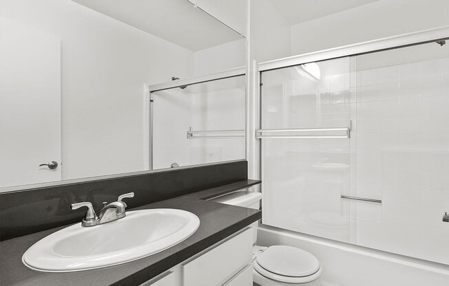 Modern styled bathroom with shower and tub.