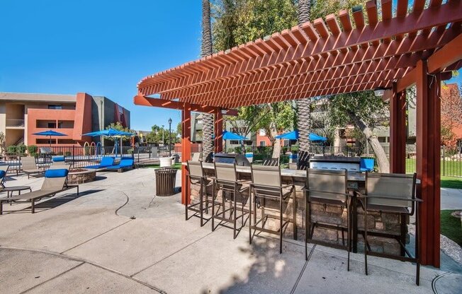 Poolside bbq area with picnic seating at Saratoga Ridge, Phoenix, 85022