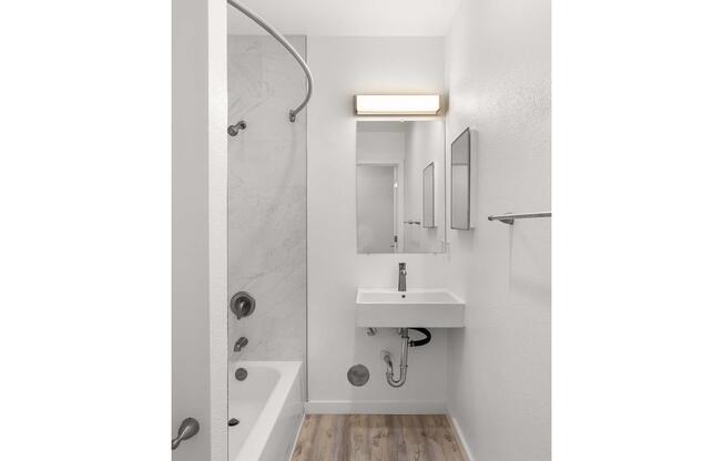 a close up of a sink and a mirror