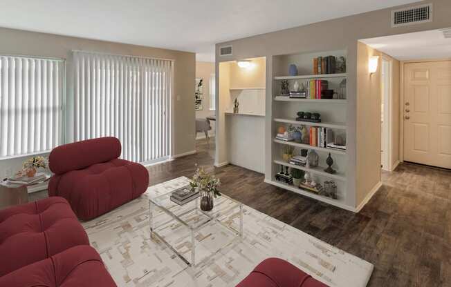 This is a photo of a virtually staged living room in the 650 square foot 1 bedroom, 1 bath apartment at Preston Park Apartments in Dallas, TX.