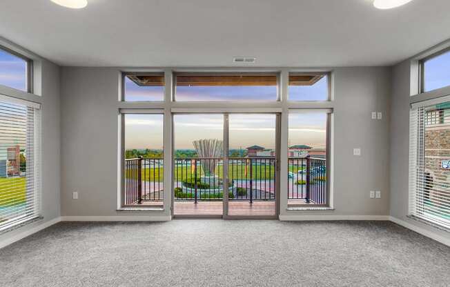 Large living area with floor to ceiling windows providing lots of natural light at WH Flats