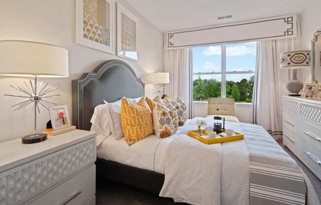 a bedroom with a large bed and a window