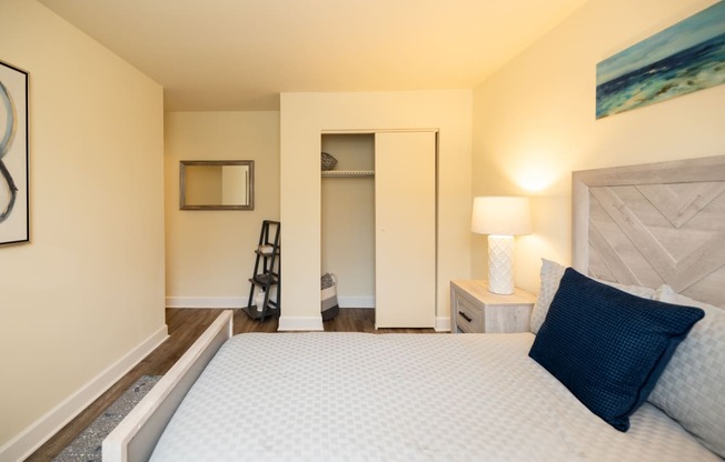 Bedroom with a large bed and a closet at Rockdale Gardens Apartments*, Baltimore, MD