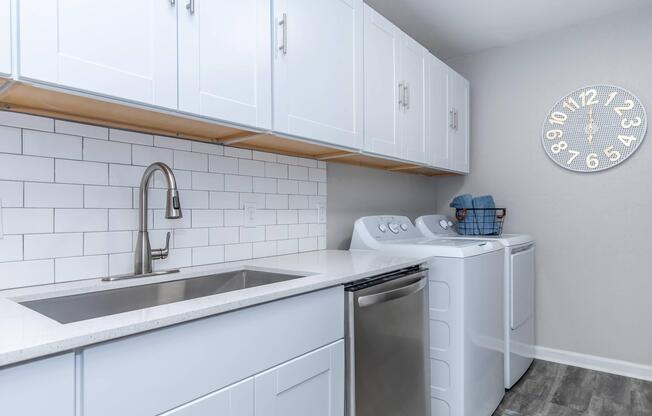 a kitchen with a sink and a refrigerator