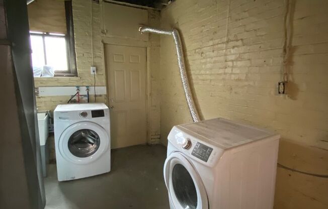 Updated 2BR Row Home in Lawrenceville – Central Air, Pets Welcome, Private Yard & Basement!