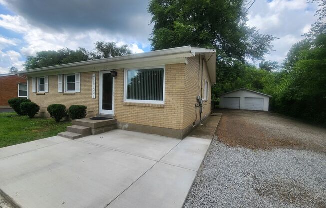 Beautiful and spacious 3 bedroom 1 bath home with large detached garage and updates!