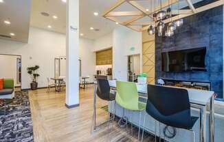 A modern office space with a fireplace and a bar area.