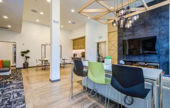 A modern office space with a fireplace and a bar area.