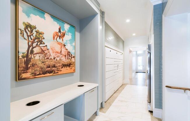 Community mail and package room with built-in counters and organized lockers creates a polished arrival point for daily deliveries.