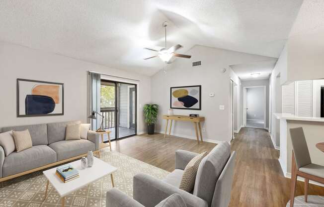 a living room with couches and a coffee table