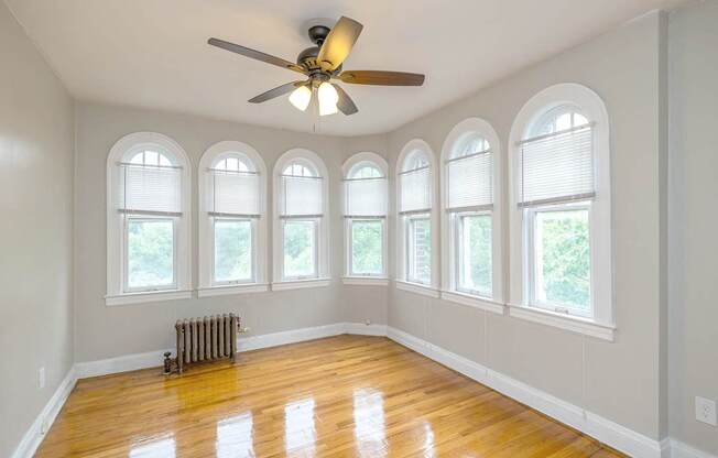 Lewis Manor room with natural light and a ceiling fan.