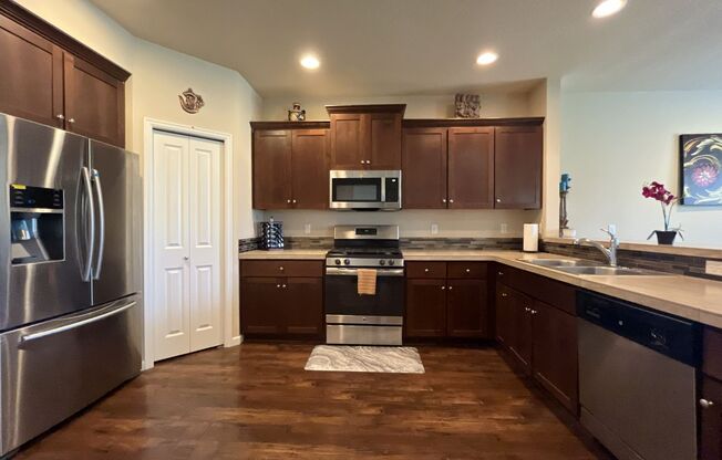 Stunning 4 Bedroom + Loft Bethany Home with Open Layout, Stainless Steel Kitchen, Two Car Garage and Driveway