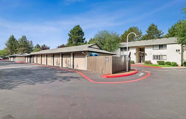 A parking lot with a red circle painted on the pavement.