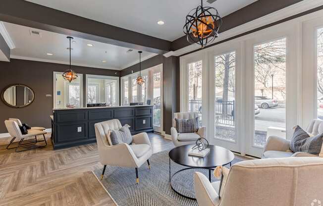 a living room with couches and chairs and a bar