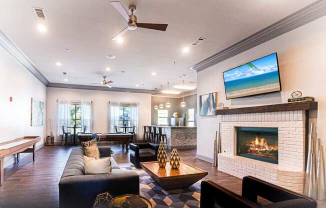 the living room has a fireplace and a seating area