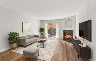 A living room with a fireplace and a couch.