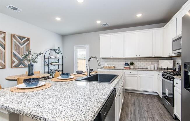a kitchen with a large counter top and a stove top oven