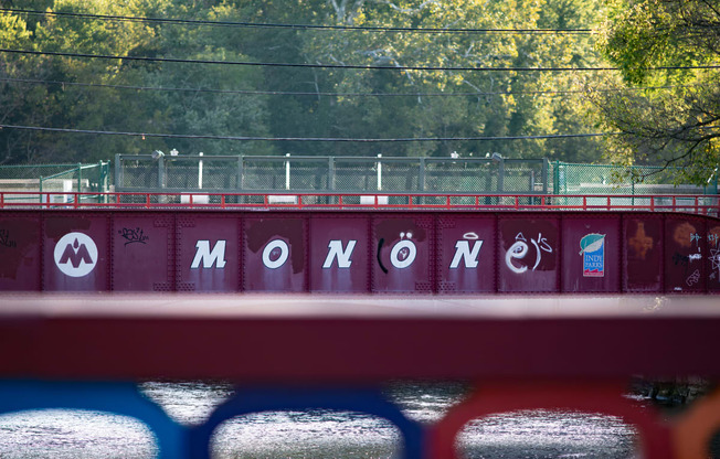 a train bridge with the word momomo written on it