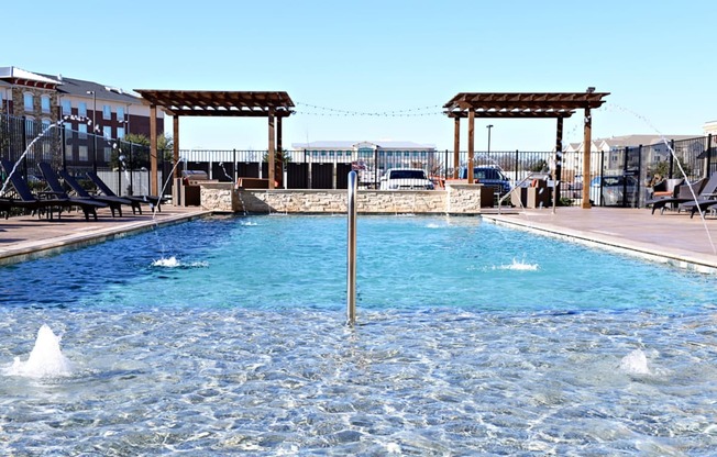 the pool is heated and has views of the mountains and the sky