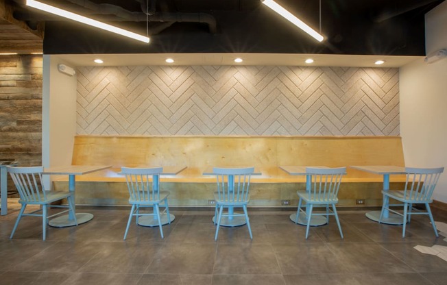 a table and chairs in front of a wood wall at 511 Meeting, South Carolina, 29403
