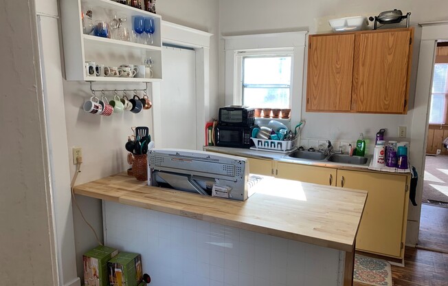 Fenced-in Yard + Washer & Dryer + Off-Street Parking! Available August 1st!