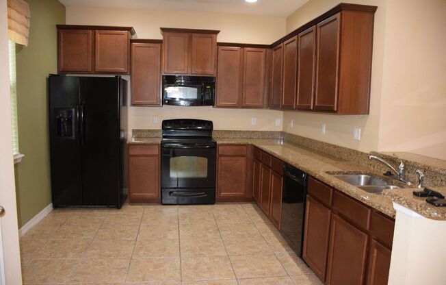 Spacious 3 Bed 2.5 Bath Condo in Gated Tucker Oaks Community with No Rear Neighbors!