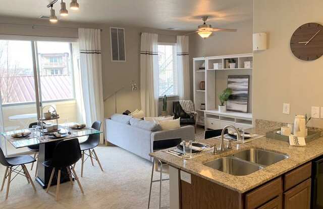 Living Room With Kitchen View at San Marino Apartments, South Jordan, UT, 84095