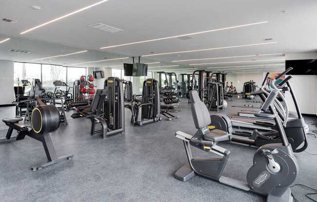 A gym with a variety of equipment including treadmills, weights, and exercise machines.at 829 Garfield, New Jersey